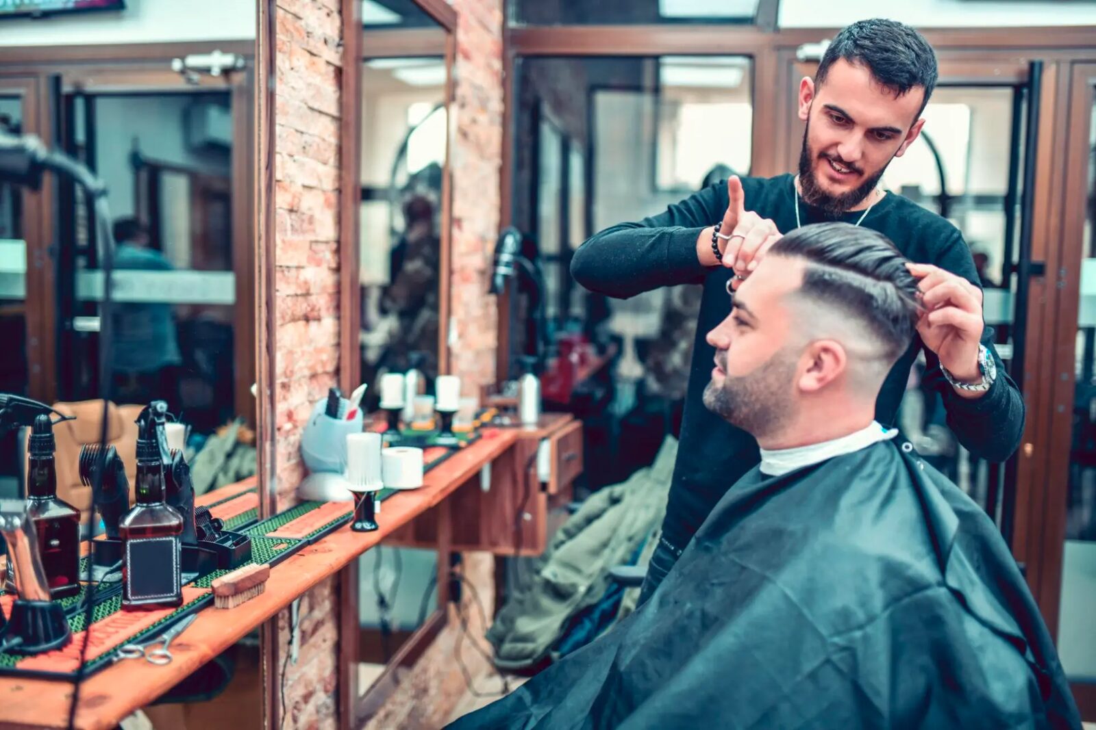 Barber styling a client's hair